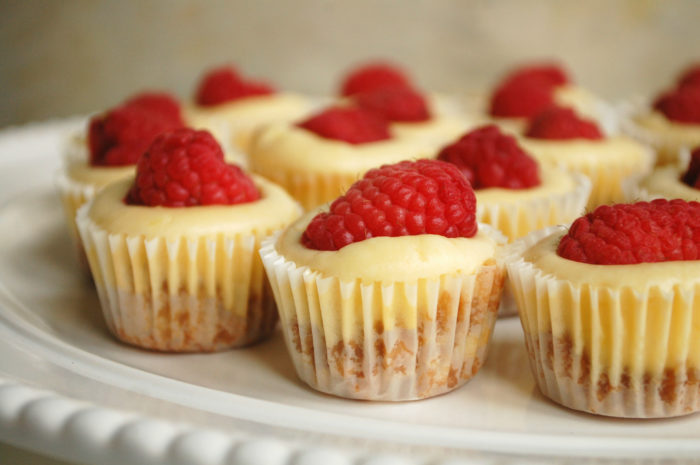 These mini lemon and raspberry cheesecakes are the perfect mini valentines day dessert recipe! they are the perfect ending for your at-home valentines day dinner.