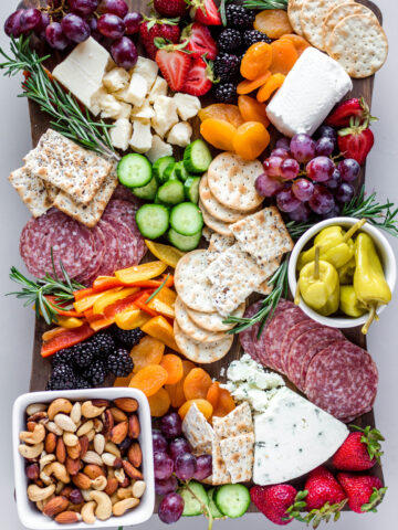 I love a good summer charcuterie board. With fresh produce from farmer's markets and summer BBQs, they are such a simple summer appetizer to put together. Here's how to put together a summer charcuterie board.
