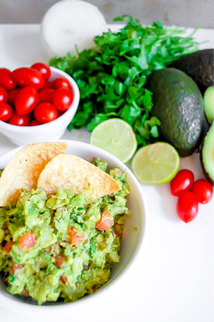 this loaded guacamole is one of the best cold dip recipes to serve for your at-home valentine's day dinner. This is so easy, and who doesn't love an easy homemade guacamole?!
