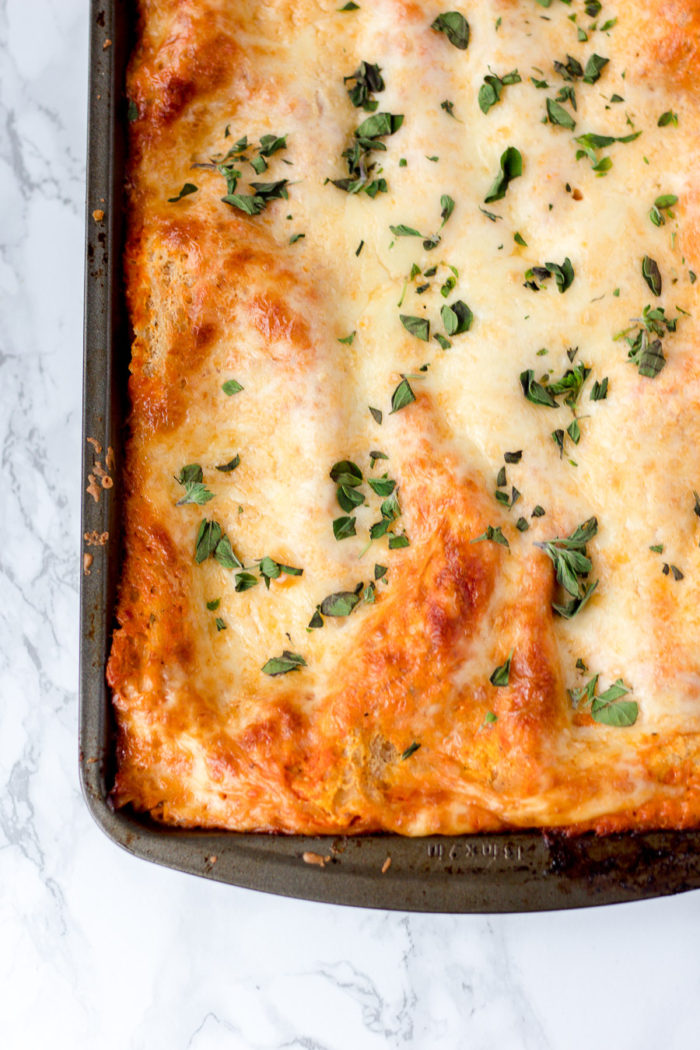This easy lasagna recipe with oven-ready lasagna noodles will soon be a favorite cozy dinner recipe! It's so easy to make and is one of my favorite comfort foods.