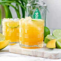 This 1800 Ultimate Mango margarita copycat recipe is one of my favorite go-to margarita recipes. What makes it so easy is the use of Mango kombucha or your favorite mango fruit juice. This is definitely a mix between a mango margarita recipe and a mango Paloma recipe. It is the perfect balance of mango and tequila.
