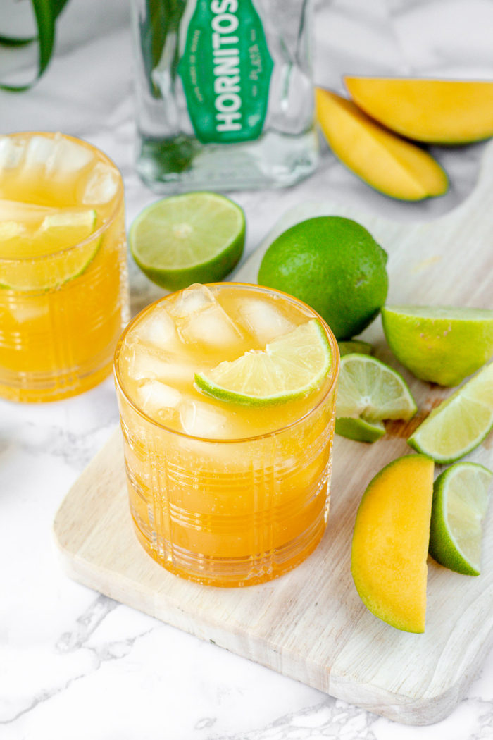 This 1800 Ultimate Mango margarita copycat recipe is one of my favorite go-to margarita recipes. What makes it so easy is the use of Mango kombucha or your favorite mango fruit juice. This is definitely a mix between a mango margarita recipe and a mango Paloma recipe. It is the perfect balance of mango and tequila. 