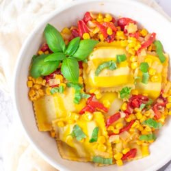 I love the Trader Joe's Sweet Corn and Burrata Ravioli and most recently, Aldi has come out with a similar product! The Aldi seasonal ravioli never disappoint, and I created this roasted red pepper sauce with white wine and garlic to pair perfectly with the ravioli and it's the perfect summer pasta dish.