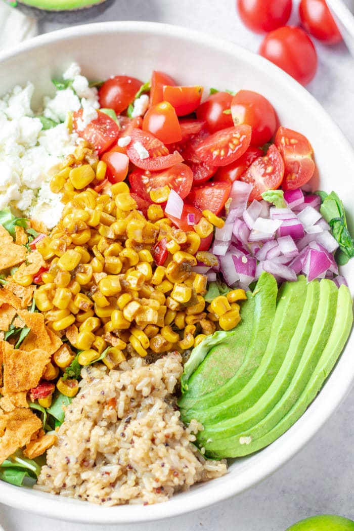 Sweetgreen's seasonal corn elote bowl was recently released, and it is so good. It brings together some of summer's best produce all with their lime cilantro jalapeño vinaigrette, ugh. So much goodness all in one bowl. Here's how you can make this copycat Sweetgreen Corn Elote Bowl recipe at home!