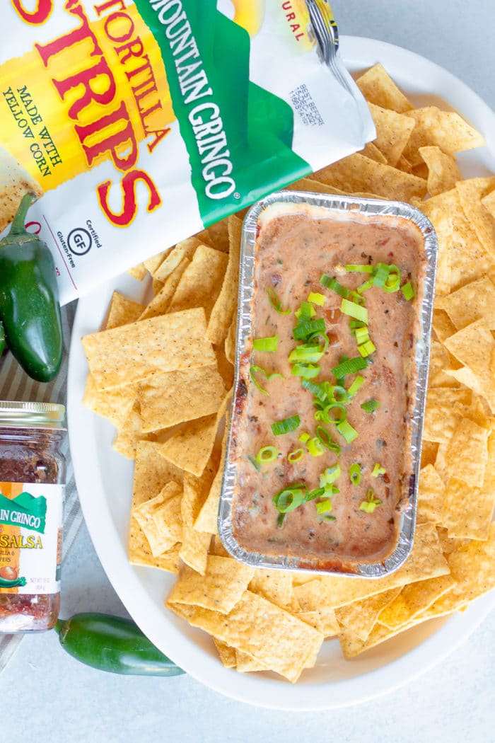 This easy queso dip recipe on the grill is the perfect fall tailgating appetizer recipe! Making queso on the grill is a game changer.