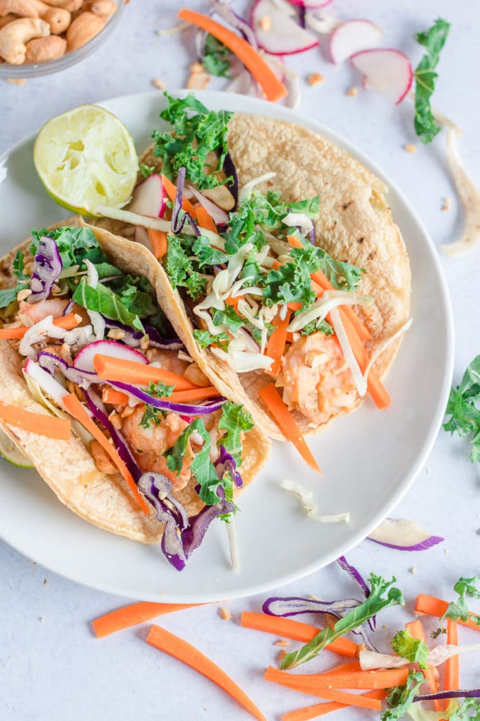 Let's talk about these air fryer spicy cashew butter shrimp tacos. This one of my favorite spicy cashew butter dressing recipes, it's simple, refreshing and you can get fun and creative with your shrimp taco toppings.