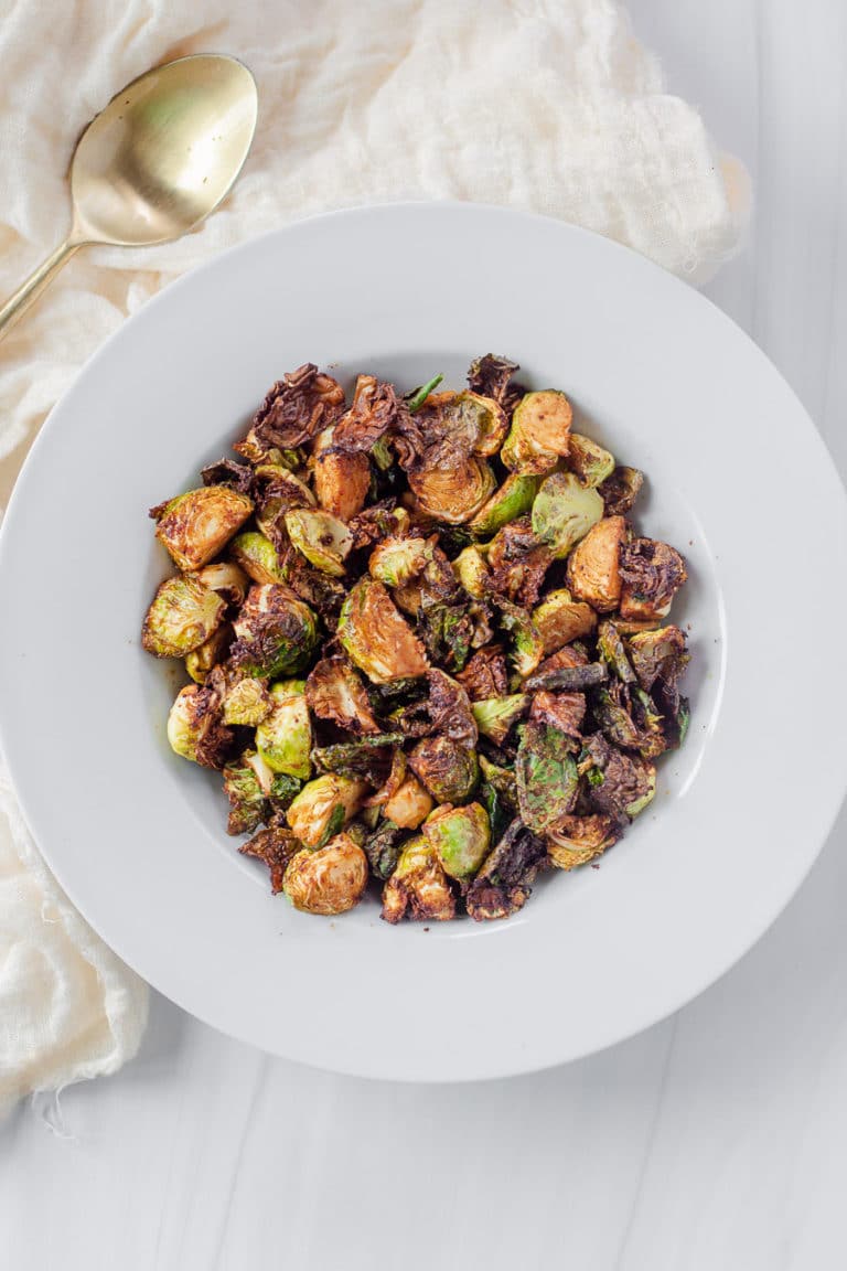 Honey Sriracha Brussels Sprouts in the air fryer is the best way to cook brussels sprouts. It's sweet, yet spicy, and such a great fall side dish recipe