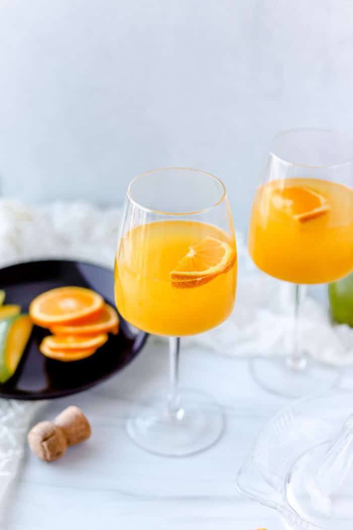 This mango mimosa is such a refreshing, tropical twist on the traditional mimosa recipe. You'll absolutely love it!