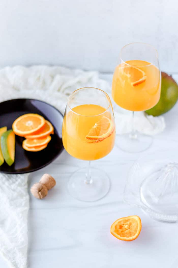 This mango mimosa is such a refreshing, tropical twist on the traditional mimosa recipe. You'll absolutely love it!