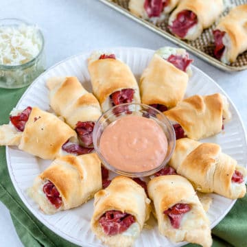 Reuben Crescent Rolls are one of my favorite easy St. Patrick's Day appetizer recipes. Dip them in thousand island dressing for a delicious crescent roll recipe!