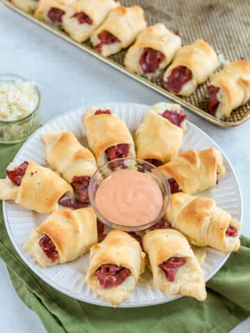 Reuben roll ups are one of my favorite easy St. Patrick's Day appetizer recipes. Dip them in thousand island dressing for a delicious crescent roll recipe!