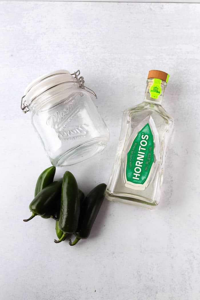 It is so easy to make homemade jalapeno infused tequila. All you need is jalapeno, tequila and an air-tight container.