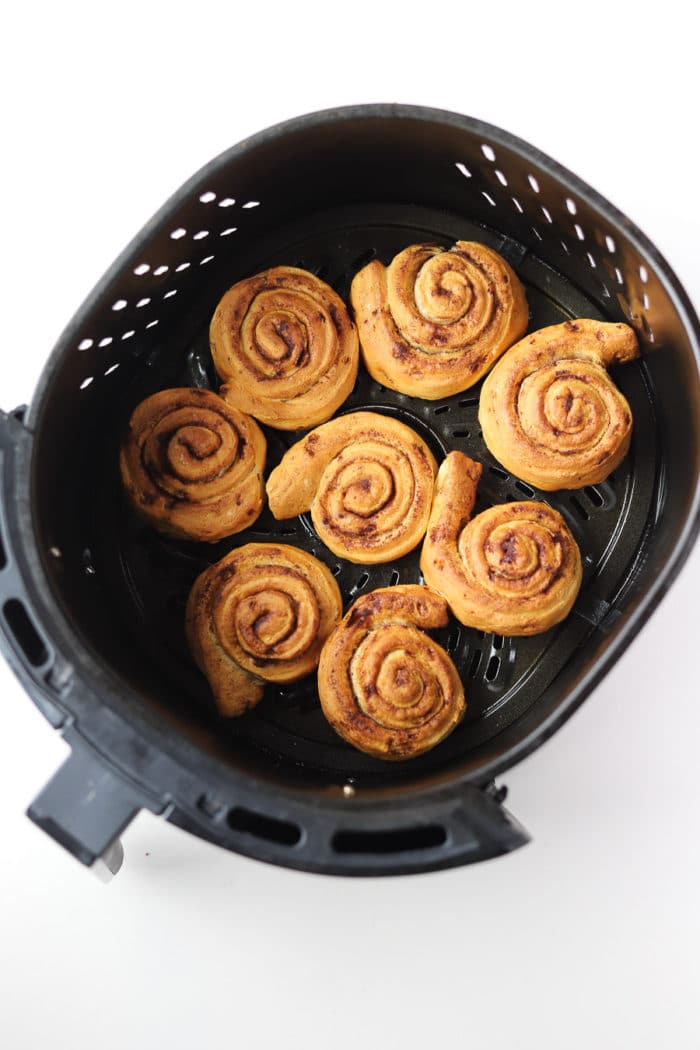 They're done in minutes. 6-8 minutes, depending on your air fryer is all it takes for these air fryer cinnamon rolls to be done.