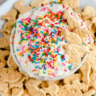 Remember the 90's classic Dunkaroos? I'm sharing this homemade Dunkaroo Dip so you can whip up all the nostalgia and get everyone hooked on this easy cake batter dessert dip. It's seriously so good!