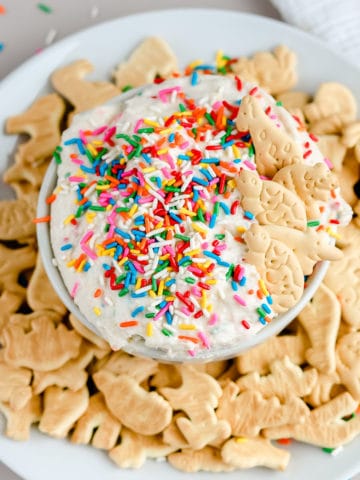 Remember the 90's classic Dunkaroos? I'm sharing this homemade Dunkaroo Dip so you can whip up all the nostalgia and get everyone hooked on this easy cake batter dessert dip. It's seriously so good!