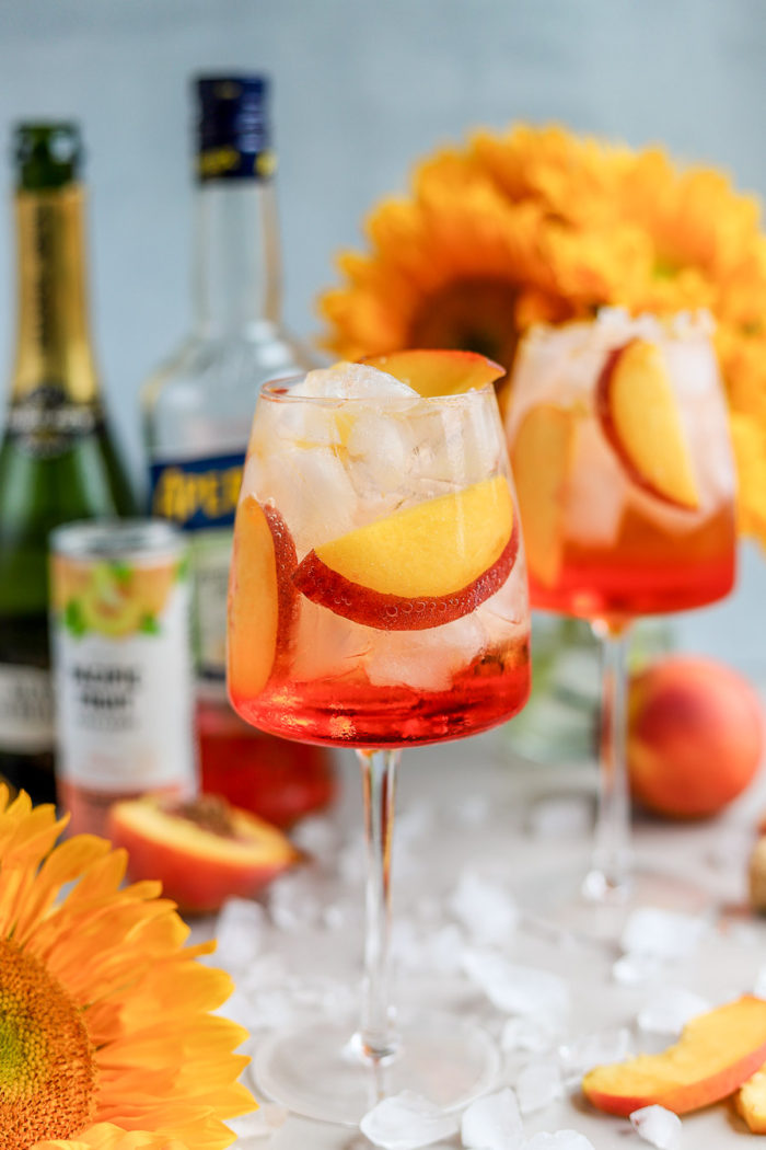 I love a good Aperol Spritz, especially in the summertime. But, to add a fun and summery twist to the traditional Aperol Spritz recipe, meet the Peach Aperol Spritz!