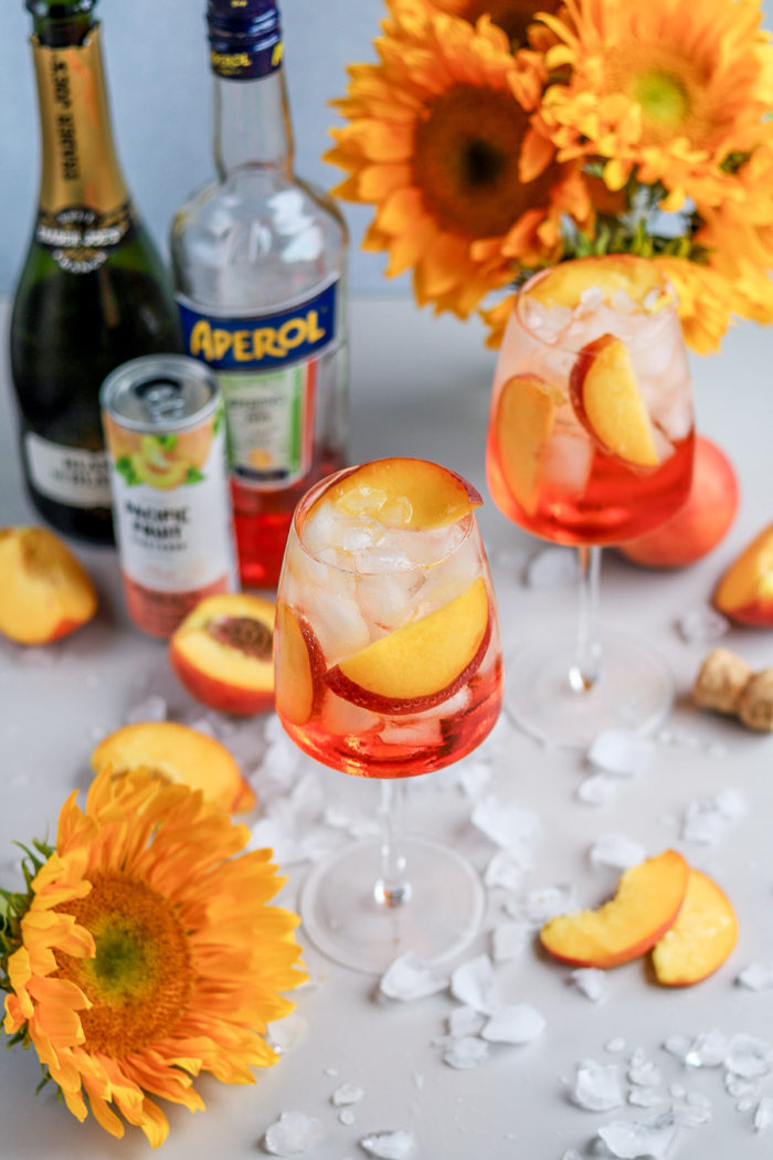 I love a good Aperol Spritz, especially in the summertime. But, to add a fun and summery twist to the traditional Aperol Spritz recipe, meet the Peach Aperol Spritz!