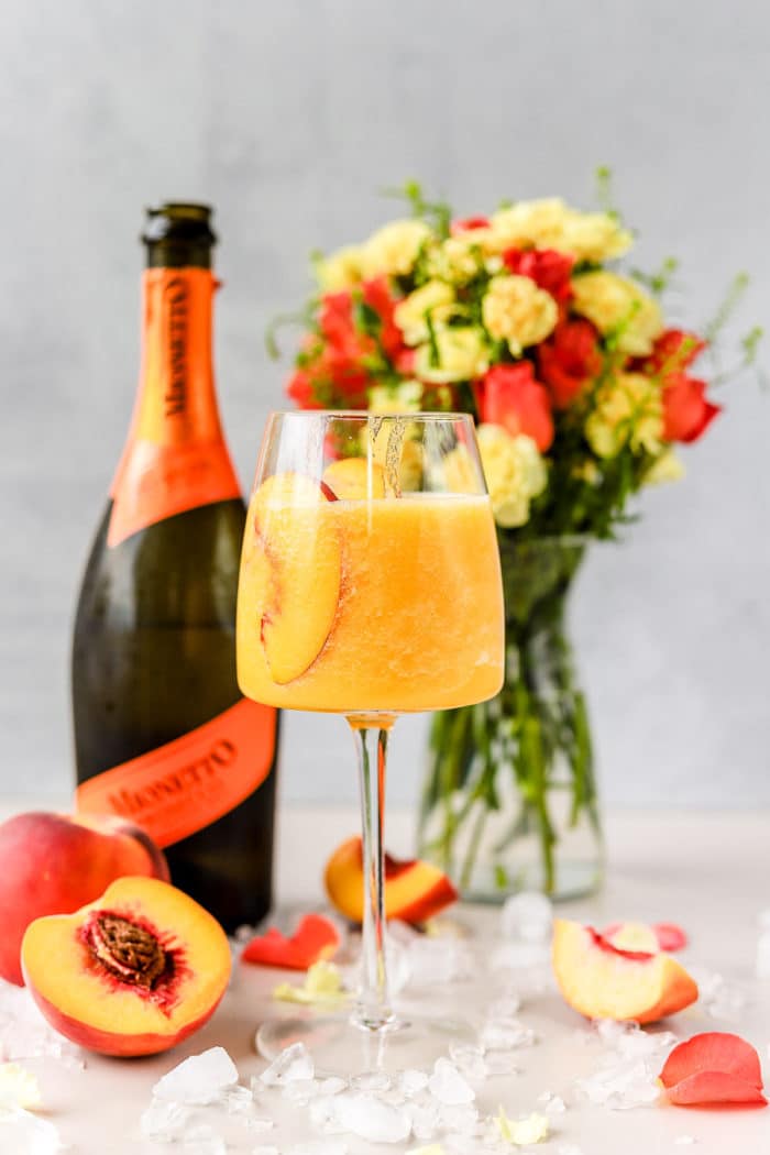 This frozen peach bellini is the perfect frozen prosecco cocktail! It is so easy to make and this is such a refreshing cocktail.