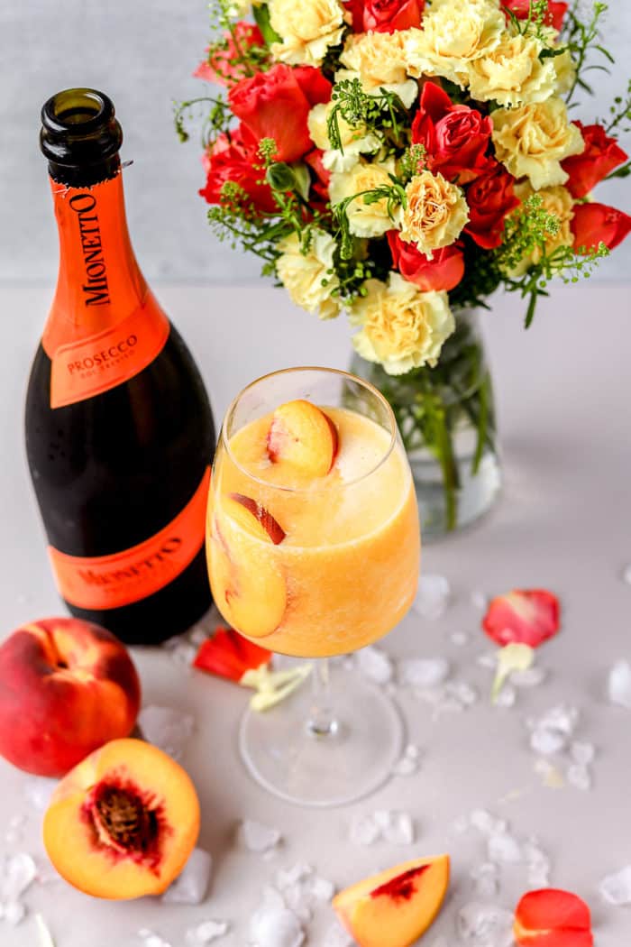 This frozen peach bellini is the perfect frozen prosecco cocktail! It is so easy to make and this is such a refreshing cocktail.