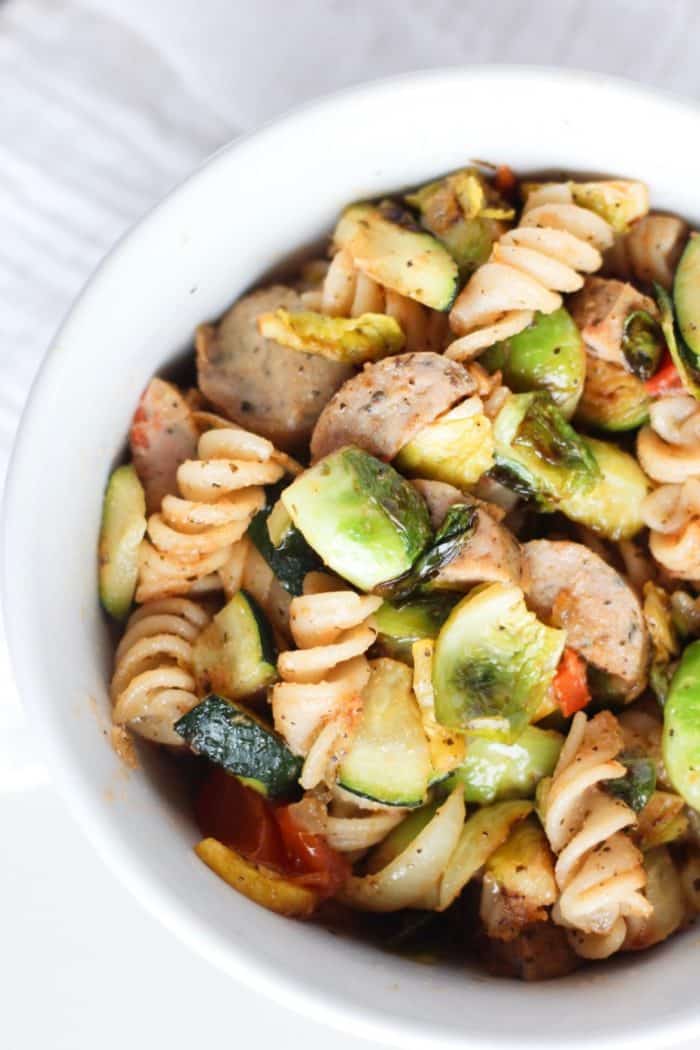 I love pairing their sweet Italian, spicy Italian, or roasted garlic chicken sausage with some brown rice pasta, and some veggies (like cherry tomatoes, mushrooms + onions) with pesto for an easy weeknight dinner.