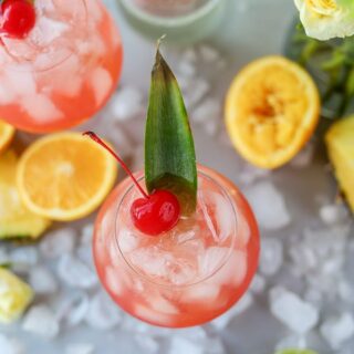 This tropical rum punch recipe is the perfect summer rum cocktail. It's refreshing, not overly sweet and easy to make as an individual cocktail or as a batch cocktail recipe.