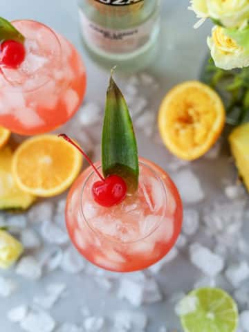 This tropical rum punch recipe is the perfect summer rum cocktail. It's refreshing, not overly sweet and easy to make as an individual cocktail or as a batch cocktail recipe.