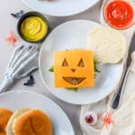 These Halloween burgers are so cute and so easy to make! If you're looking for easy Halloween food ideas, these Jack-O-Lantern burgers are it.