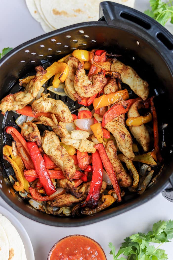 This air fryer dinner recipe is done in 30 minutes, and is so flavorful! You will love these air fryer chicken fajitas for an easy weeknight meal.