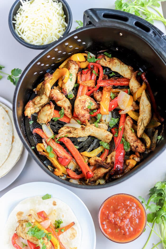 This air fryer dinner recipe is done in 30 minutes, and is so flavorful! You will love these air fryer chicken fajitas for an easy weeknight meal. 