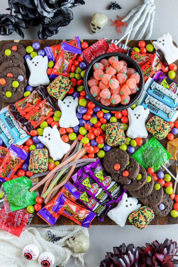 This Halloween candy charcuterie board is an adorable way to display candy for all your Halloween parties this year. It's a perfect dessert charcuterie board for the occasion.