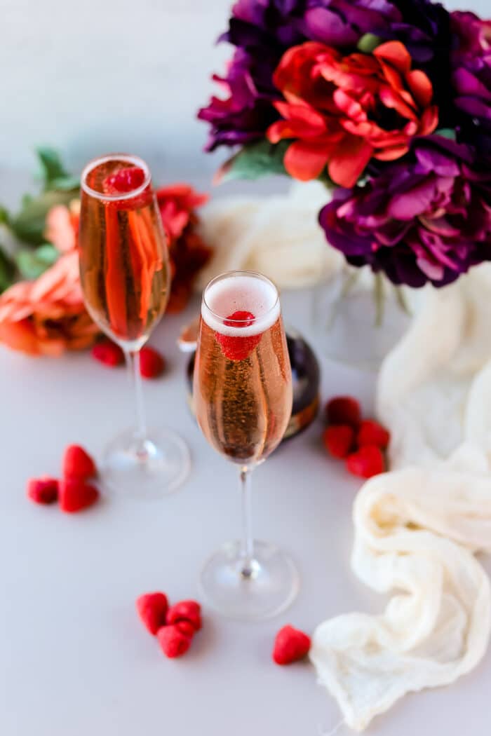 When you're making drinks for any holiday, you can never go wrong with a champagne cocktail. This raspberry champagne cocktail recipe with Chambord is so perfect for almost any holiday!