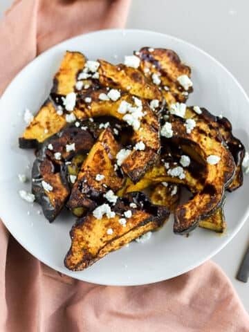 Air fryer acorn squash will quickly be your favorite way of cooking winter squash if you haven't tried it. I use a little bit of honey, chipotle powder, garlic, and salt for this lovely, spicy and savory flavor combination.