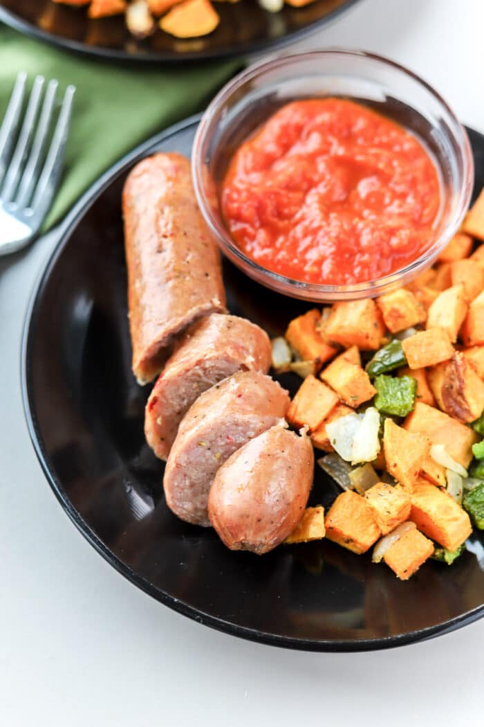 If you're looking for a quick and healthy air fryer recipe idea, this air fryer chicken sausage and veggies is perfect. It's done in under 20 minutes, including prep time!