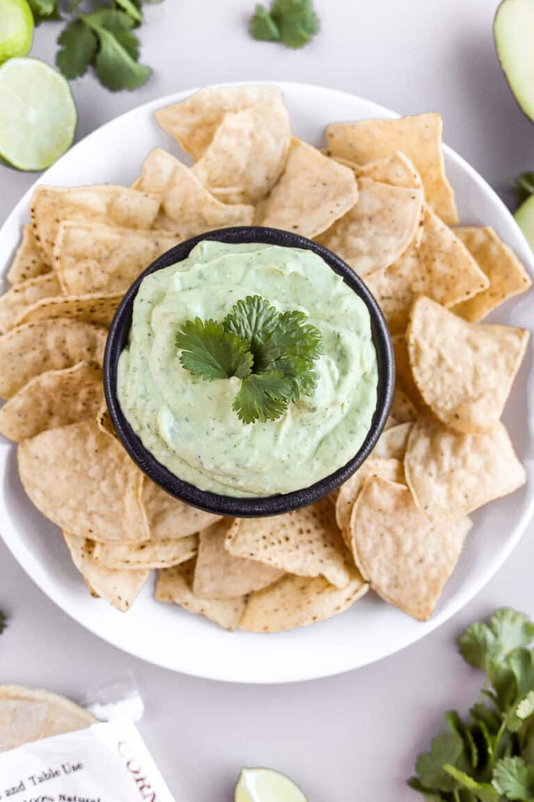 This avocado cream sauce with greek yogurt is so simple to put together. It's so full of flavor and perfect for tacos, fish, chicken or salads. Let's make it!