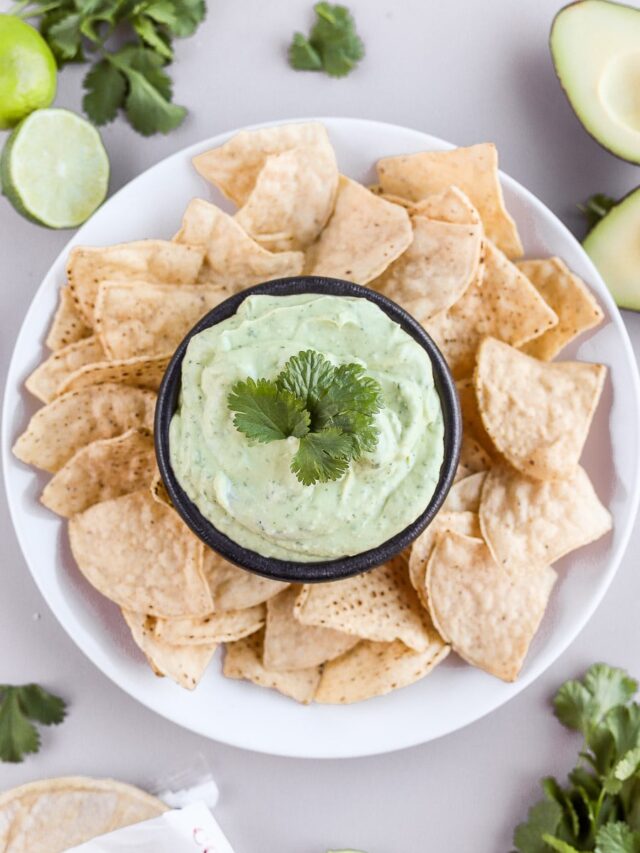 This avocado cream sauce with greek yogurt is so simple to put together. It's so full of flavor and perfect for tacos, fish, chicken or salads. Let's make it!