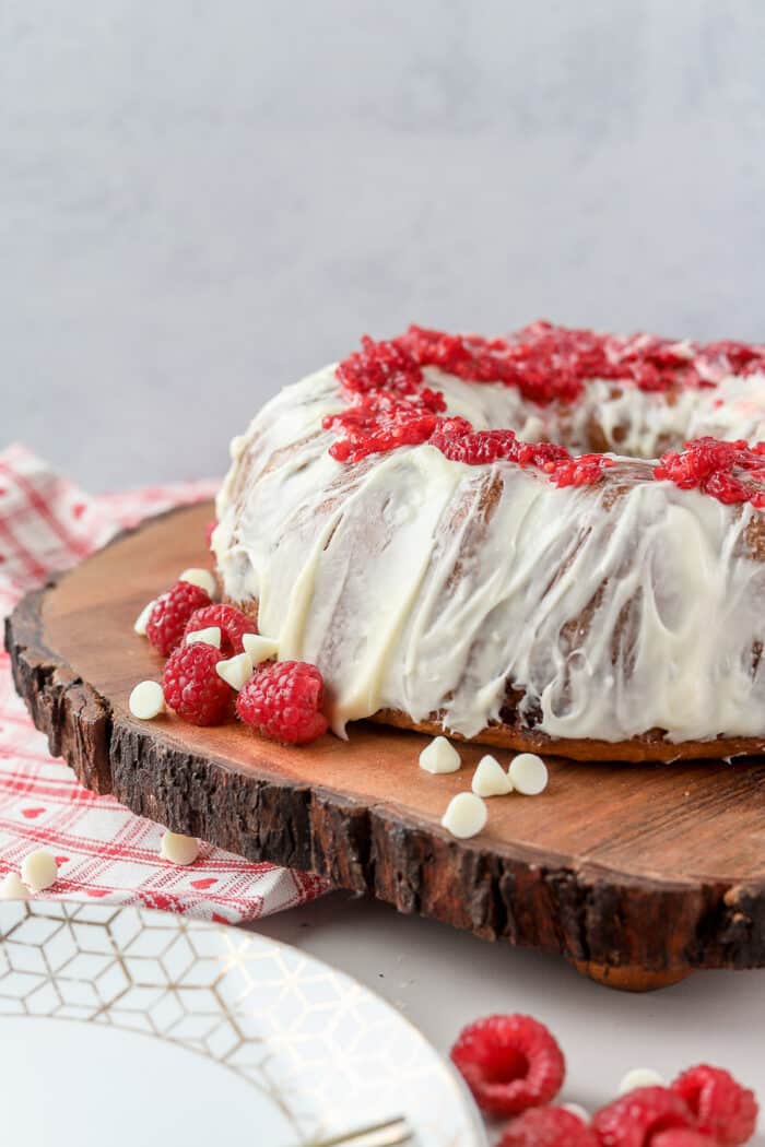 This is one of my favorite cakes, ever. This Nothing Bundt Cake White Chocolate Raspberry is the perfect balance of sweetness mixed with a hint of tart from the raspberries. Let’s make it!