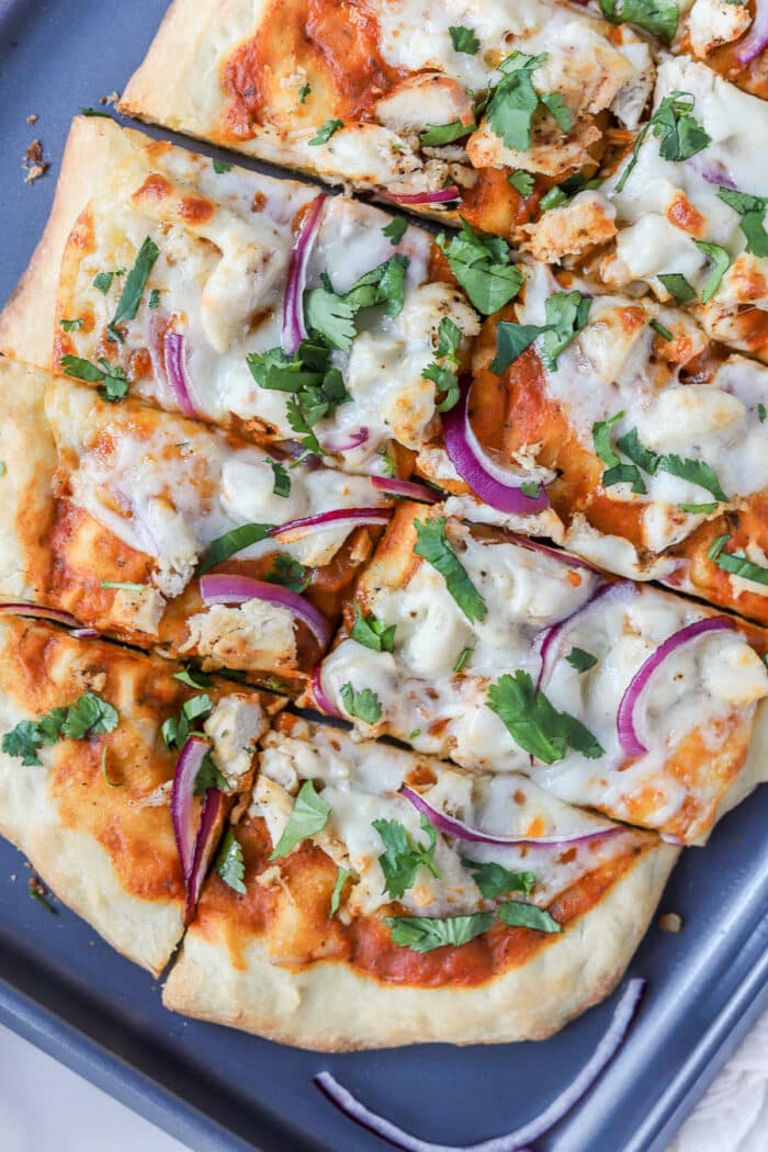 This tikka masala pizza with chicken is such a fun twist on homemade pizza! It's packed full of flavor, super easy to make and you'll love this whether it be for a pizza night at home or an easy weeknight dinner.