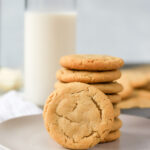 stack of brown butter sugar cookies with milk.