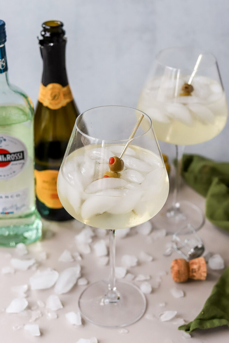 spritz bianco garnished with olives.