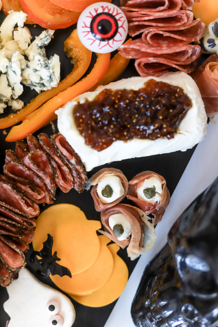 halloween charcuterie board with antipasti eyeballs